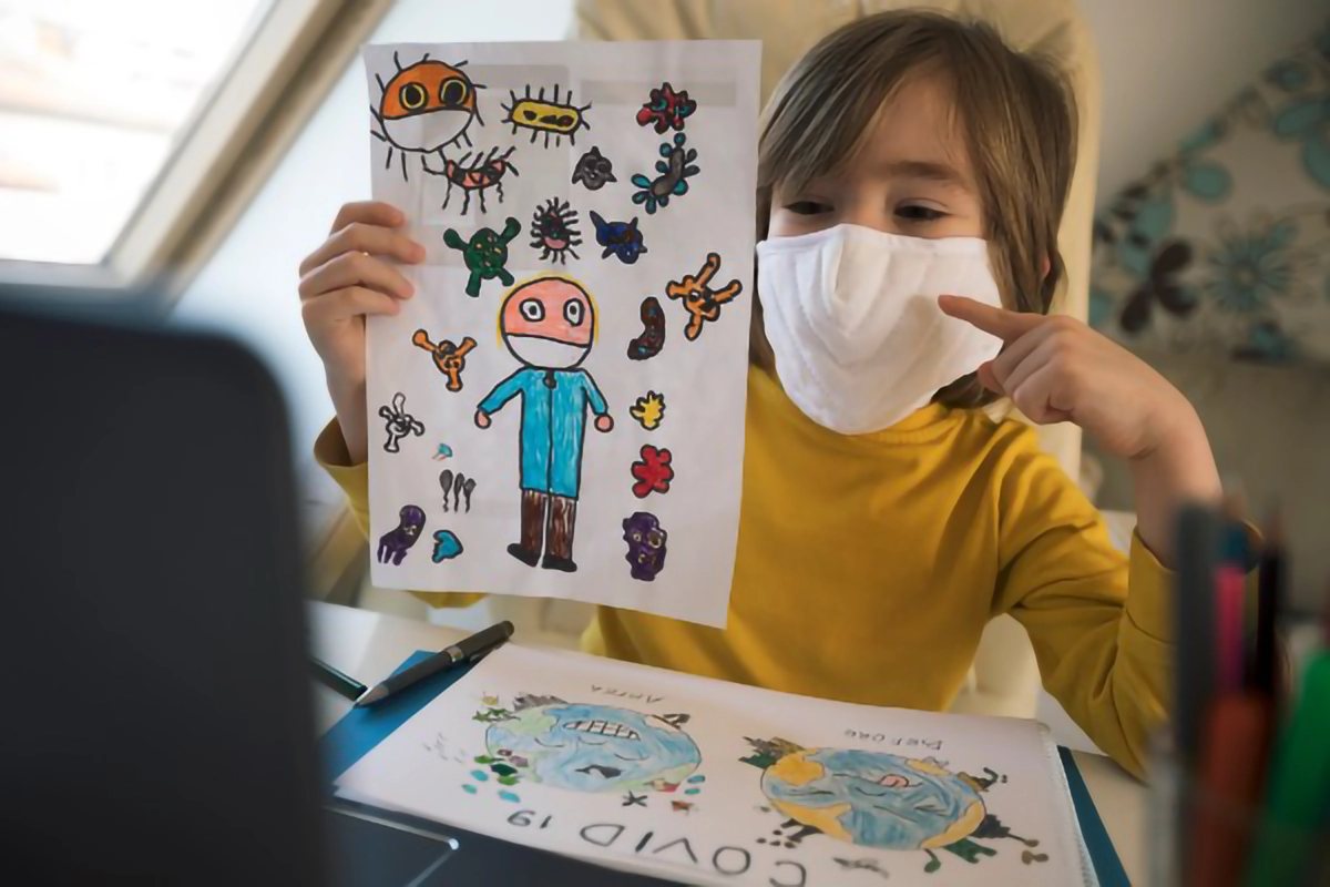 Kid with drawing in mask